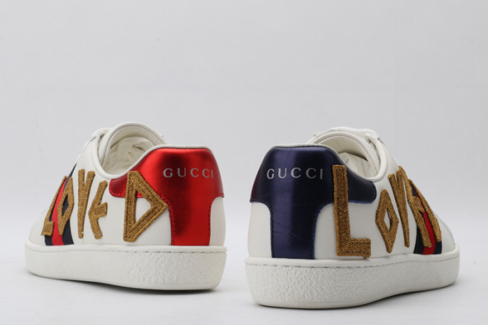 gu ace embroidered low-top sneaker